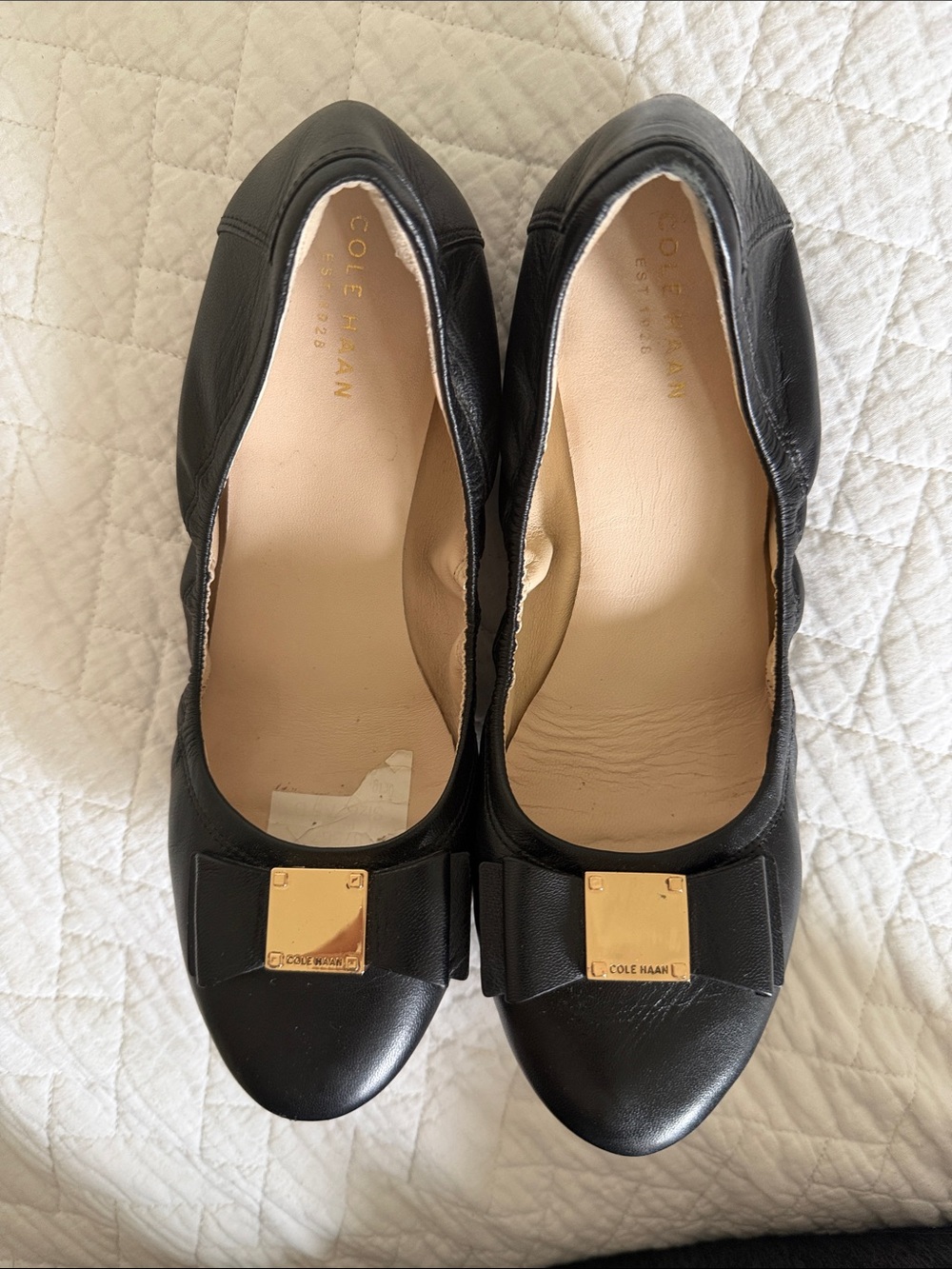 Cole Haan Black Leather Bow Flats with Gold Plaque